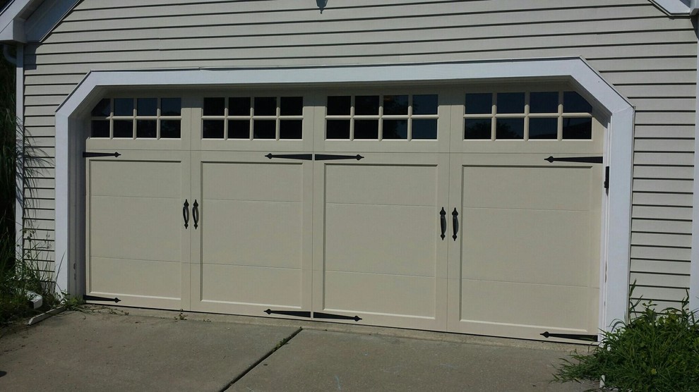 This is an example of a large traditional attached two-car garage in Philadelphia.
