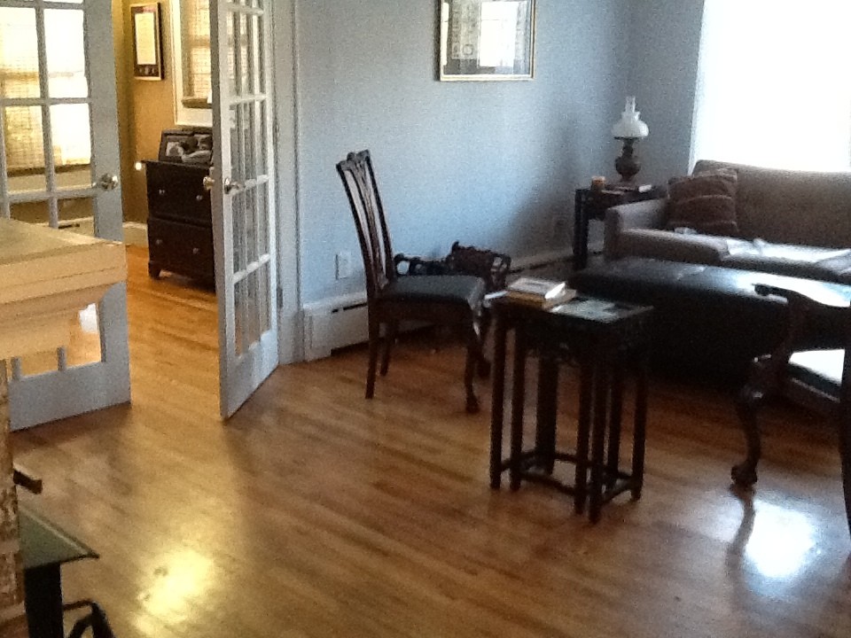 Living room with too many doors and windows