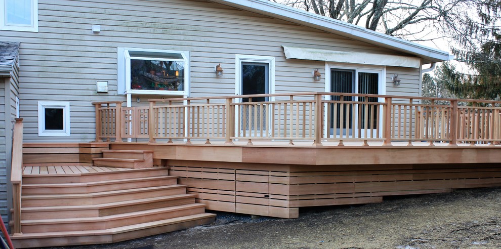 Inspiration for an arts and crafts backyard deck in New York with with skirting.