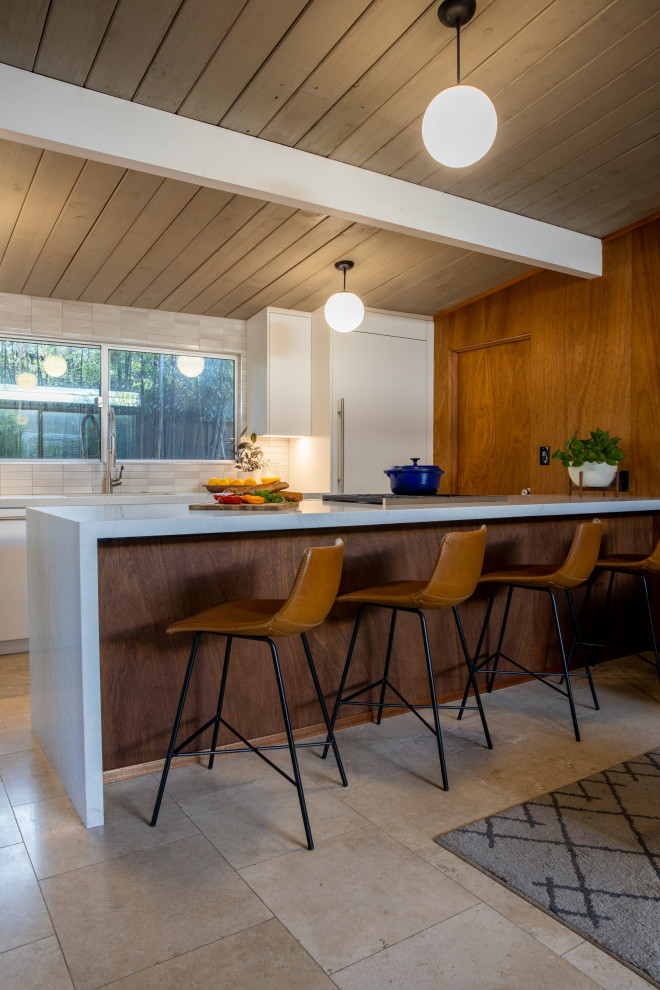 Design ideas for a midcentury eat-in kitchen in San Francisco with flat-panel cabinets.