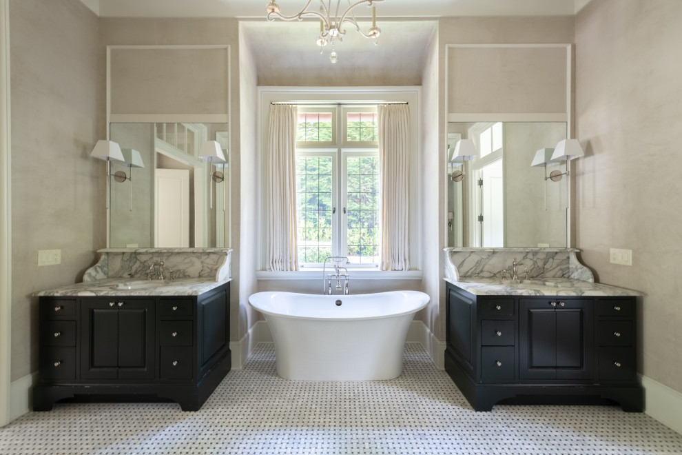 Design ideas for a mid-sized contemporary master bathroom in Atlanta with raised-panel cabinets, grey cabinets, a freestanding tub, beige walls, ceramic floors, an undermount sink, marble benchtops, white benchtops, a double vanity and a built-in vanity.
