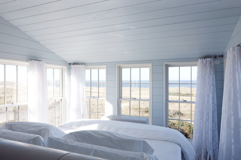 Inspiration for a small beach style master bedroom in Boston with blue walls.
