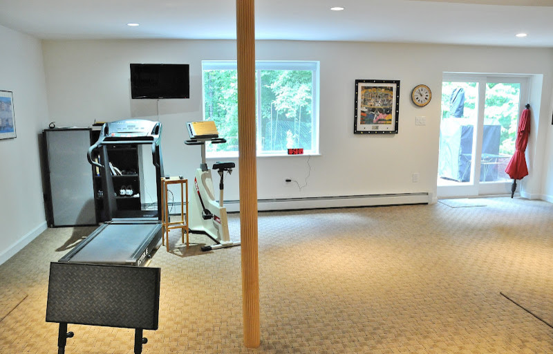 Photo of a large traditional multipurpose gym in Baltimore with white walls and carpet.