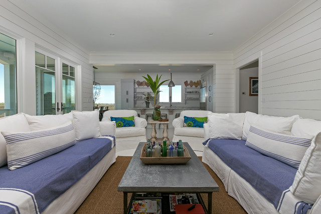 White House White Family Room With Blue Couches White Wood Walls