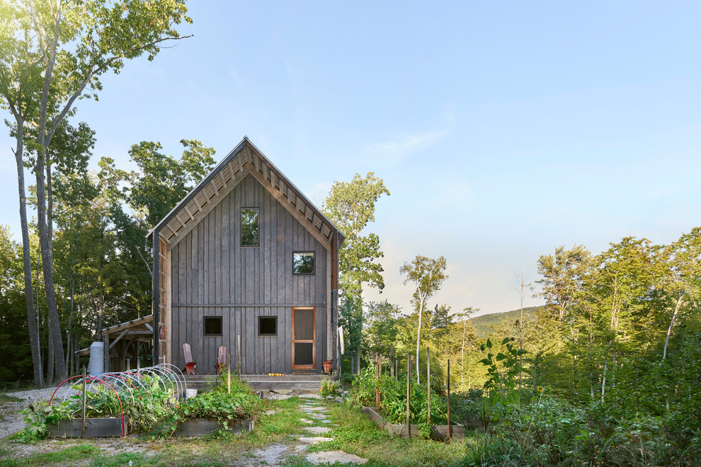 Inspiration for a country exterior in Portland Maine with wood siding and a gable roof.