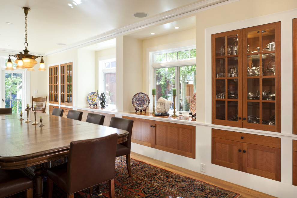 Photo of a traditional dining room in San Francisco with beige walls and medium hardwood floors.