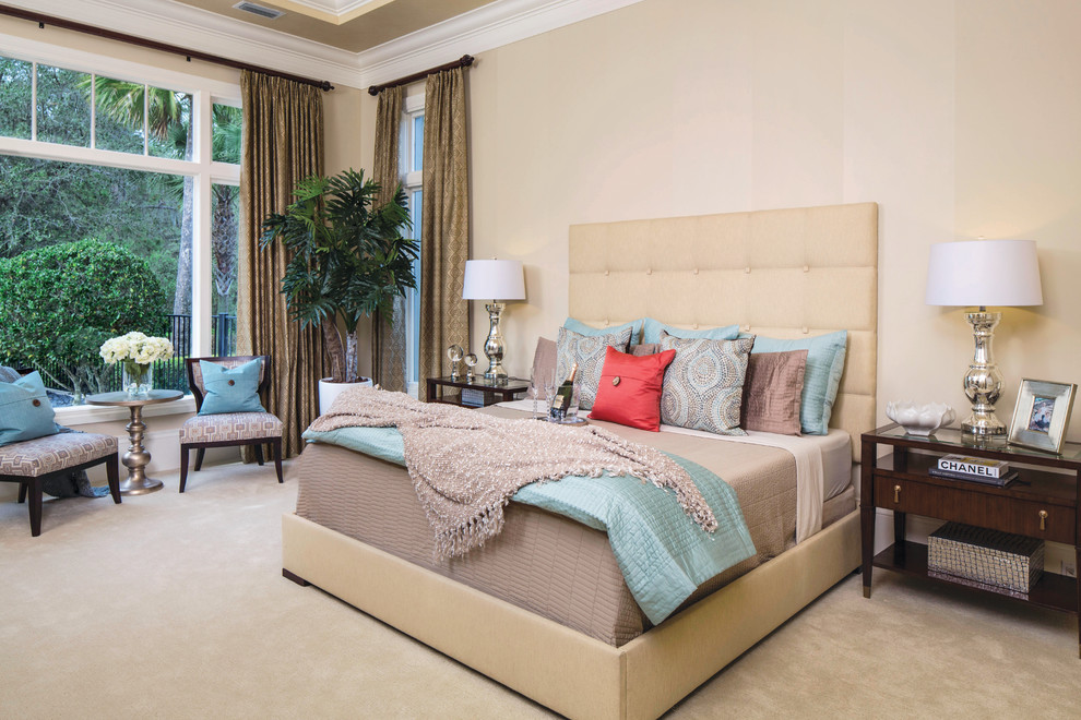 Inspiration for a transitional master bedroom in Miami with beige walls and carpet.