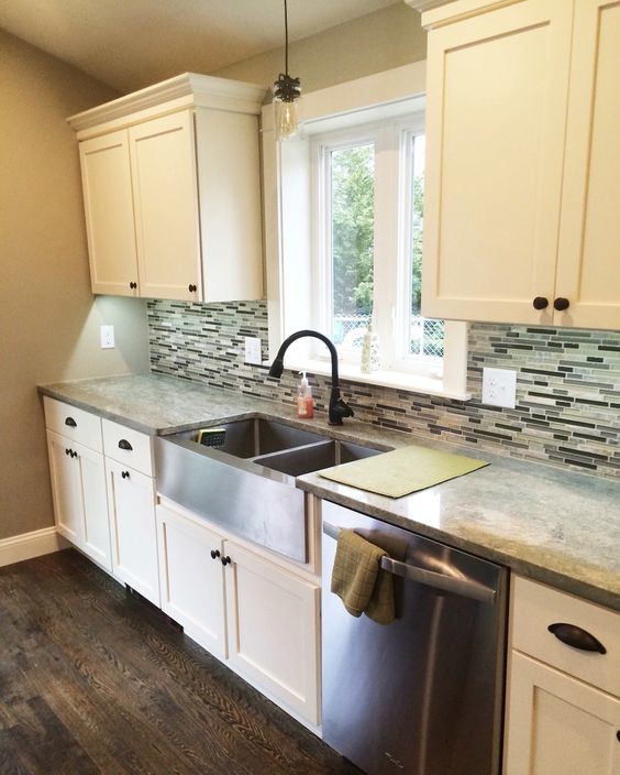 Transitional kitchen photo in Providence with recessed-panel cabinets and an island