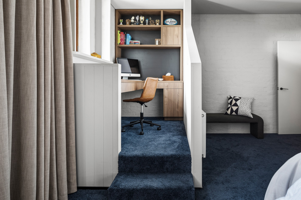 Example of a trendy home office design in Melbourne