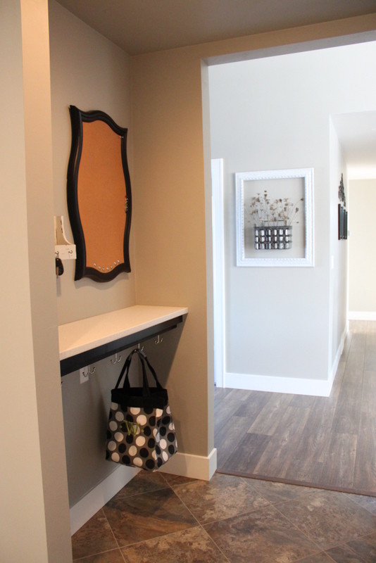 Example of a mid-sized arts and crafts entryway design with gray walls