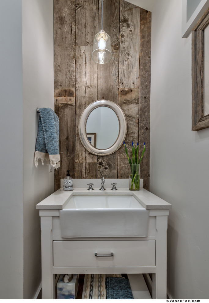 Small country powder room in Other with flat-panel cabinets, white cabinets, white walls, a trough sink, solid surface benchtops, white benchtops, a freestanding vanity and wood walls.