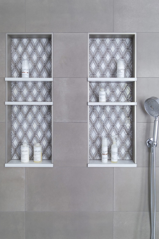 Example of a mid-sized master gray tile bathroom design in Chicago with a freestanding vanity