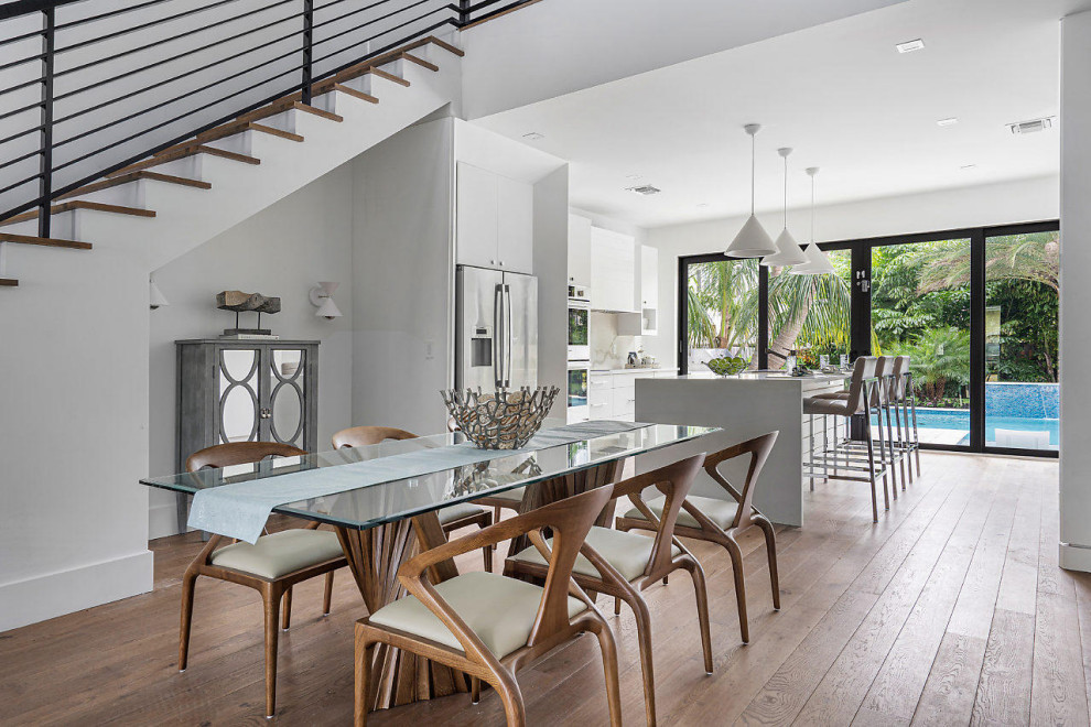 This is an example of a beach style dining room in Miami.