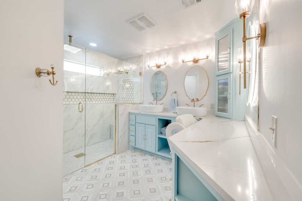 Inspiration for a large classic ensuite bathroom in Oklahoma City with raised-panel cabinets, blue cabinets, a built-in shower, yellow tiles, ceramic tiles, white walls, porcelain flooring, a vessel sink, granite worktops, multi-coloured floors, a hinged door, white worktops, a wall niche, double sinks and a built in vanity unit.
