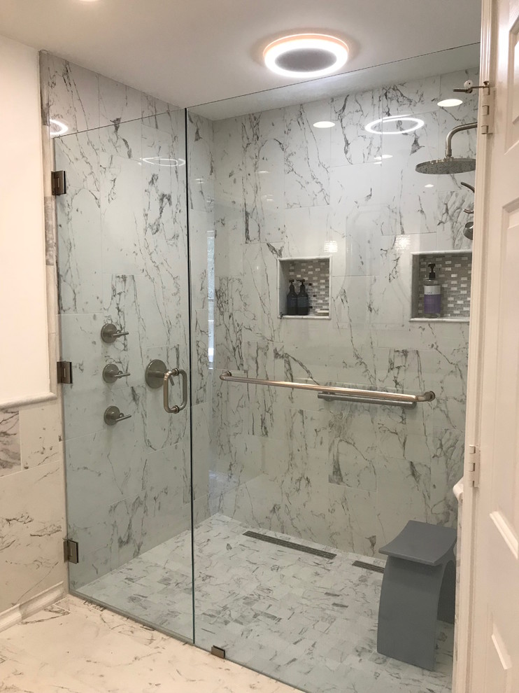 Photo of a large contemporary master bathroom in Atlanta with shaker cabinets, white cabinets, a freestanding tub, a double shower, a one-piece toilet, black and white tile, mosaic tile, white walls, marble floors, a console sink, engineered quartz benchtops, white floor, a hinged shower door and grey benchtops.