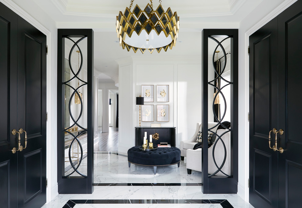 This is an example of a mid-sized transitional foyer in Toronto with white walls, porcelain floors and white floor.