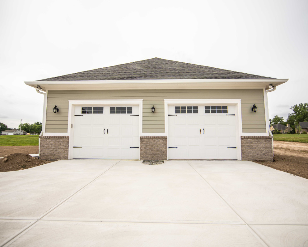 Photo of a large traditional detached two-car garage in Indianapolis.
