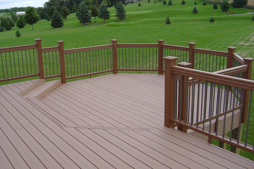 This is an example of a large traditional backyard deck in Minneapolis with no cover.