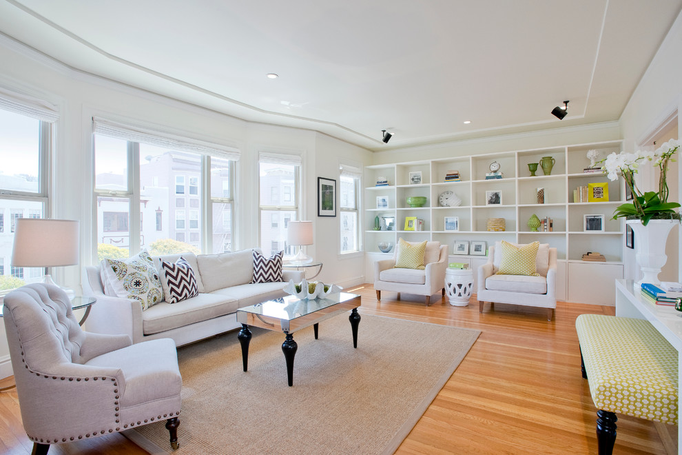 Photo of a traditional living room in San Francisco with white walls and medium hardwood floors.