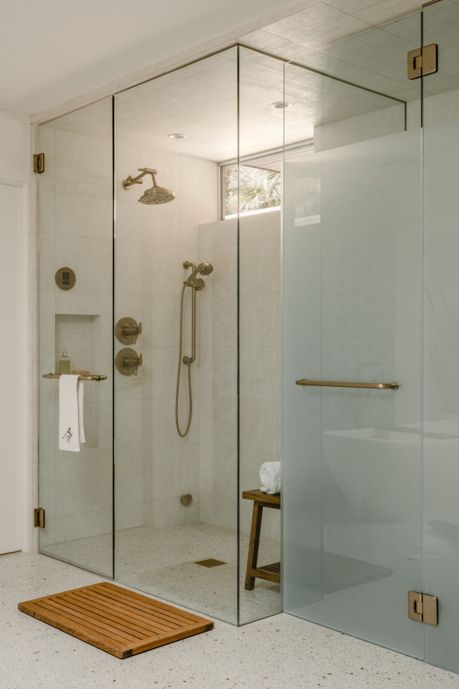 Expansive midcentury master bathroom in Other with a curbless shower, a bidet, white tile, porcelain tile, white walls, porcelain floors, multi-coloured floor, a hinged shower door and an enclosed toilet.