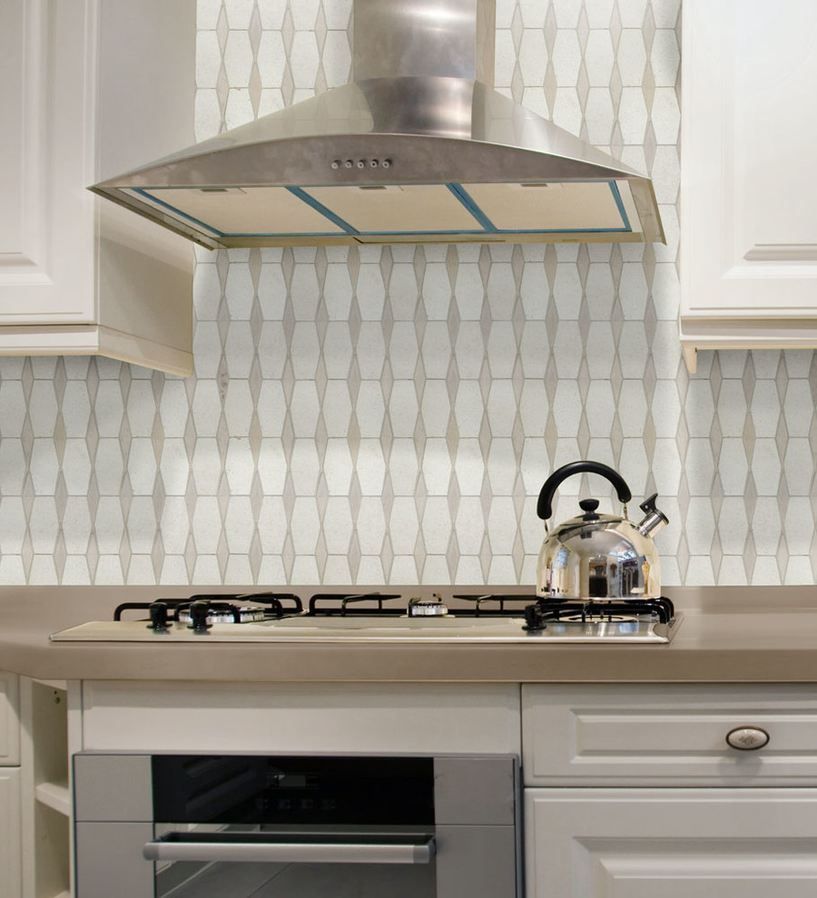 Transitional kitchen photo in DC Metro with beige backsplash, stone tile backsplash, raised-panel cabinets, white cabinets, solid surface countertops and stainless steel appliances