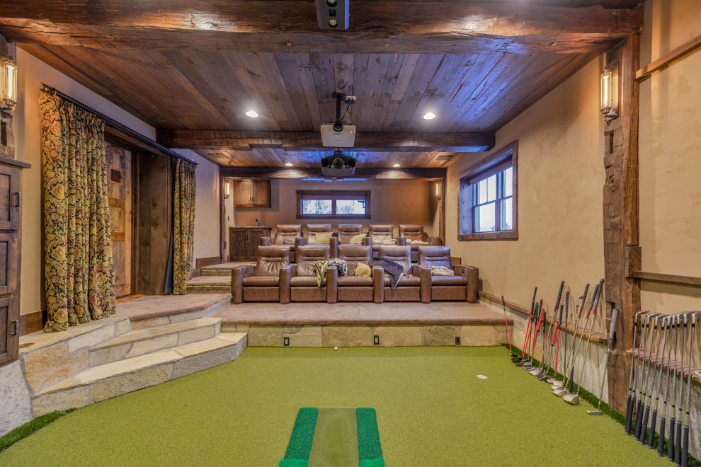 Large mountain style look-out green floor and shiplap ceiling basement photo in Minneapolis with a home theater, beige walls and no fireplace