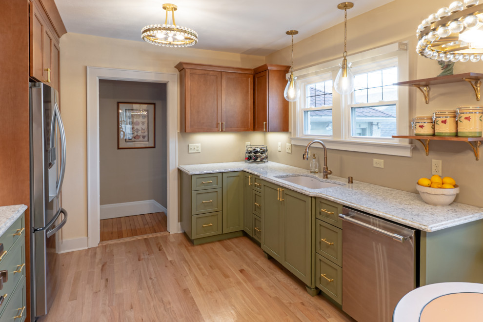 Mid-sized eclectic galley separate kitchen in Milwaukee with an undermount sink, shaker cabinets, green cabinets, quartz benchtops, multi-coloured splashback, stainless steel appliances, medium hardwood floors, no island, brown floor and multi-coloured benchtop.