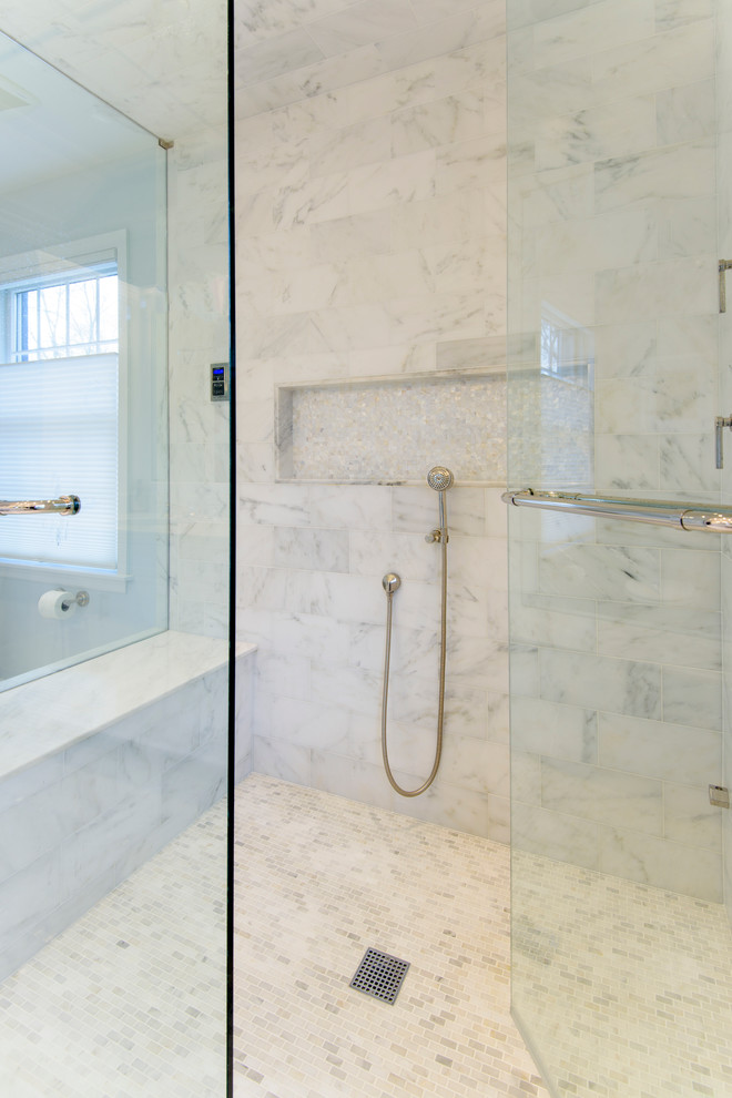 This is an example of a mid-sized contemporary master bathroom in New York with beaded inset cabinets, white cabinets, a corner shower, blue walls, ceramic floors, a drop-in sink, granite benchtops, a one-piece toilet, gray tile, white tile and stone tile.