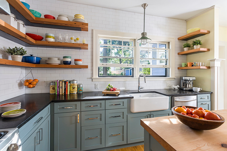 Inspiration for a mid-sized country l-shaped separate kitchen in Minneapolis with a farmhouse sink, shaker cabinets, blue cabinets, granite benchtops, white splashback, subway tile splashback, stainless steel appliances, medium hardwood floors and with island.
