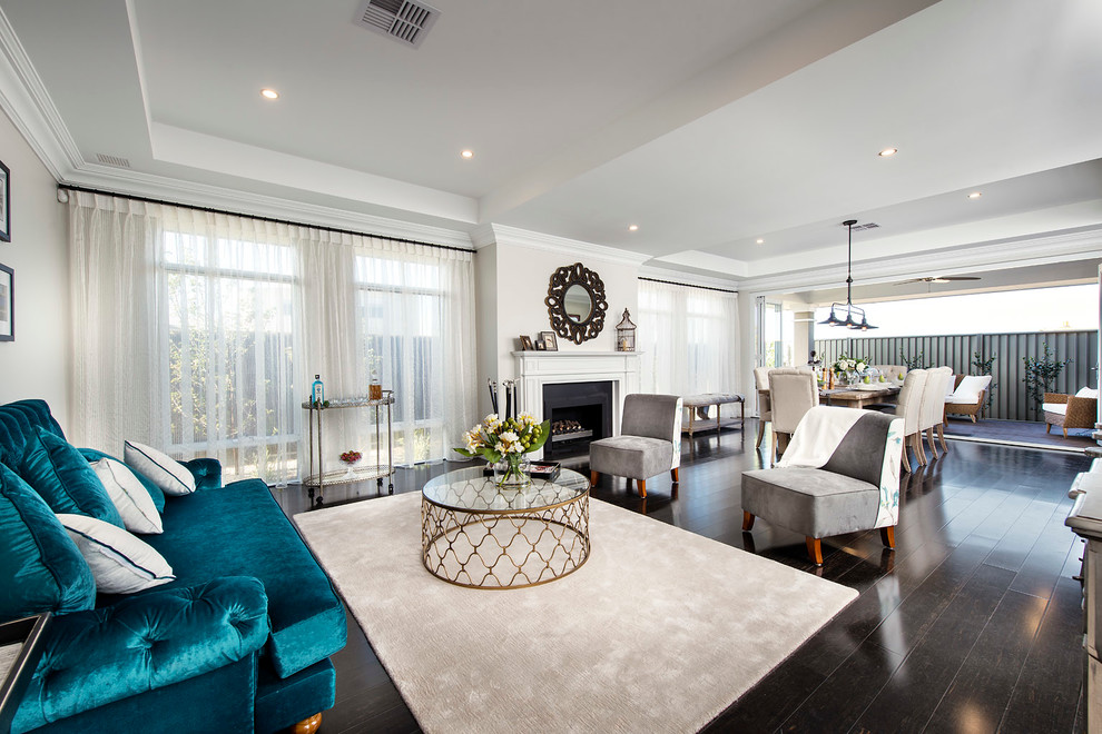 Design ideas for a transitional formal open concept living room in Perth with white walls, dark hardwood floors, a standard fireplace and a metal fireplace surround.
