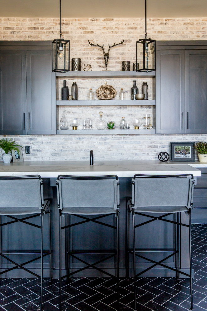 Inspiration for a large country seated home bar in Salt Lake City with an undermount sink, dark wood cabinets, brick splashback and blue floor.