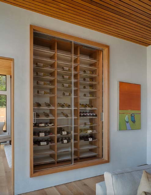 Photo of a contemporary wine cellar in Boston.