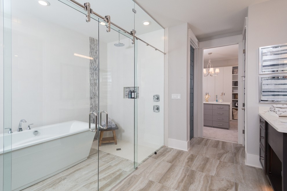 This is an example of an expansive arts and crafts master wet room bathroom in Jacksonville with recessed-panel cabinets, brown cabinets, white tile, marble, beige walls, porcelain floors, an integrated sink, marble benchtops, beige floor and a sliding shower screen.