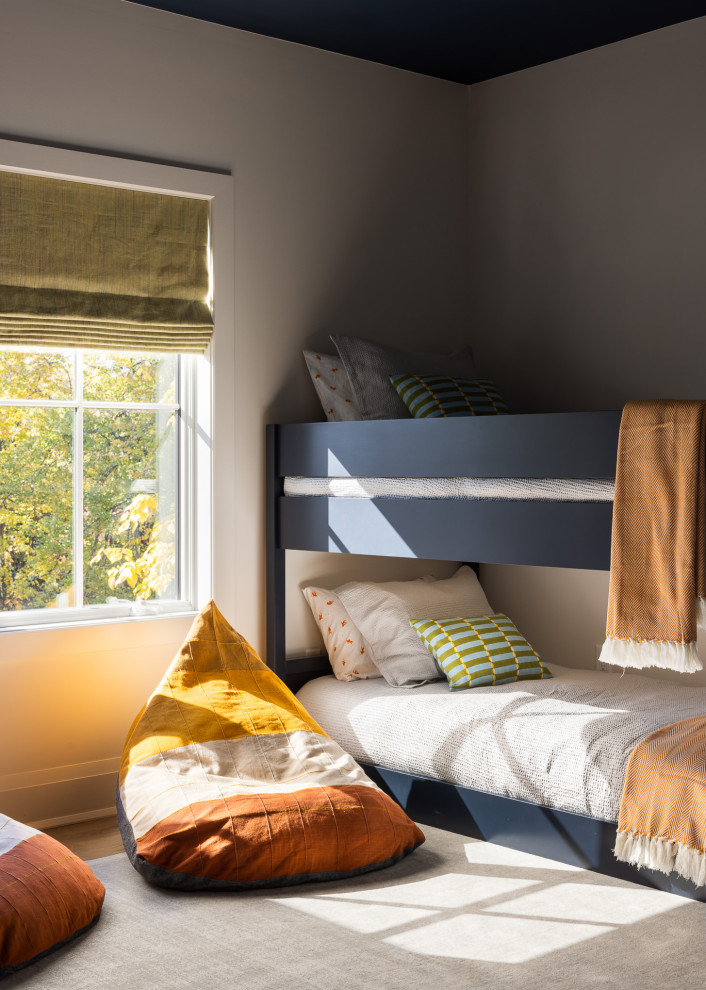 Inspiration for a small transitional gender-neutral medium tone wood floor kids' room remodel in New York with gray walls