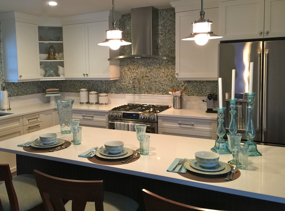 Kitchen - shabby-chic style dark wood floor kitchen idea with an undermount sink, flat-panel cabinets, white cabinets, quartz countertops, multicolored backsplash, glass tile backsplash and stainless steel appliances