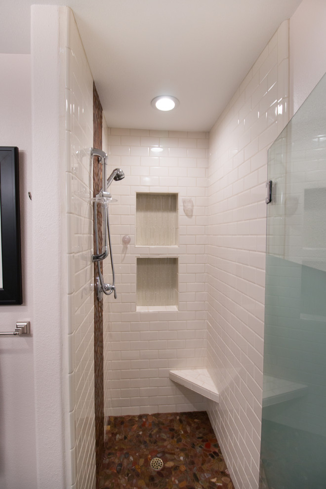 Example of a mid-sized transitional master white tile and subway tile brown floor bathroom design with flat-panel cabinets, dark wood cabinets, a two-piece toilet, pink walls, an undermount sink and quartz countertops