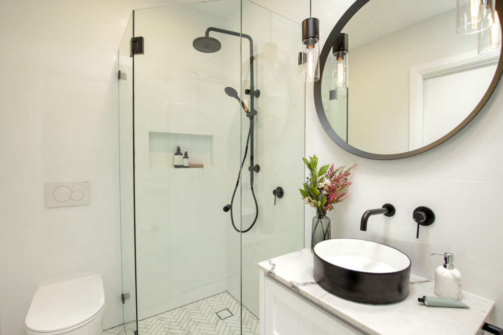 Design ideas for a mid-sized contemporary master bathroom in Sydney with shaker cabinets, white cabinets, a freestanding tub, a corner shower, a one-piece toilet, white walls, a vessel sink, a hinged shower door, a niche, a single vanity and a floating vanity.