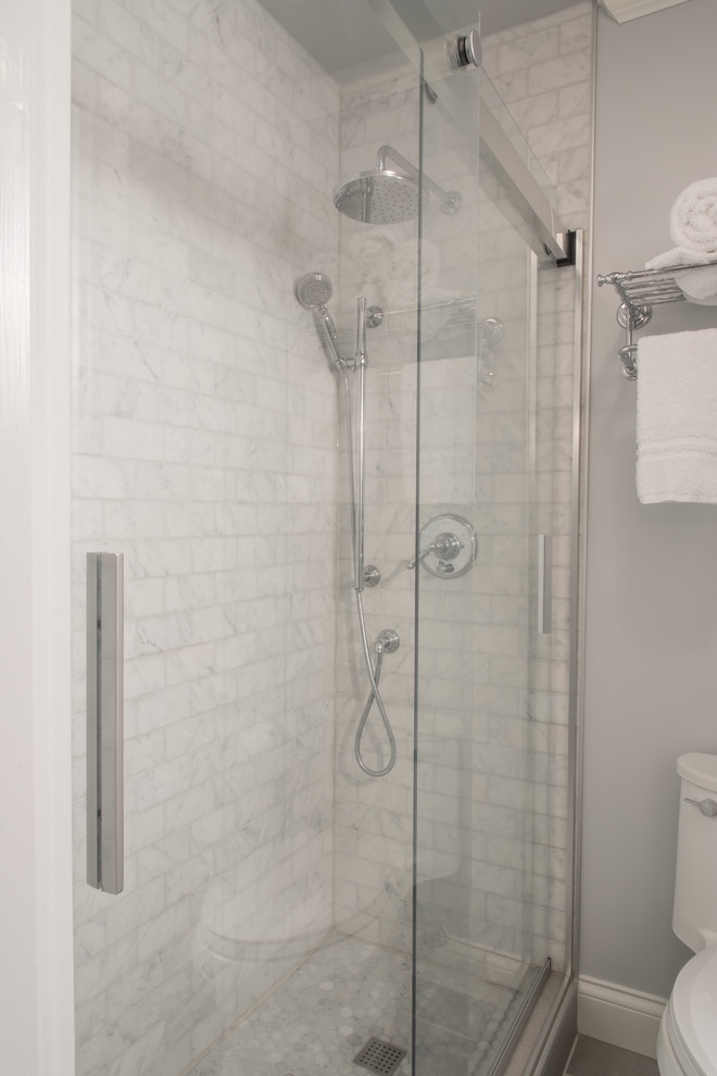 Inspiration for a mid-sized traditional 3/4 bathroom in Other with beaded inset cabinets, white cabinets, grey walls, porcelain floors, an undermount sink, granite benchtops, grey floor, an alcove shower, white tile, marble and a sliding shower screen.