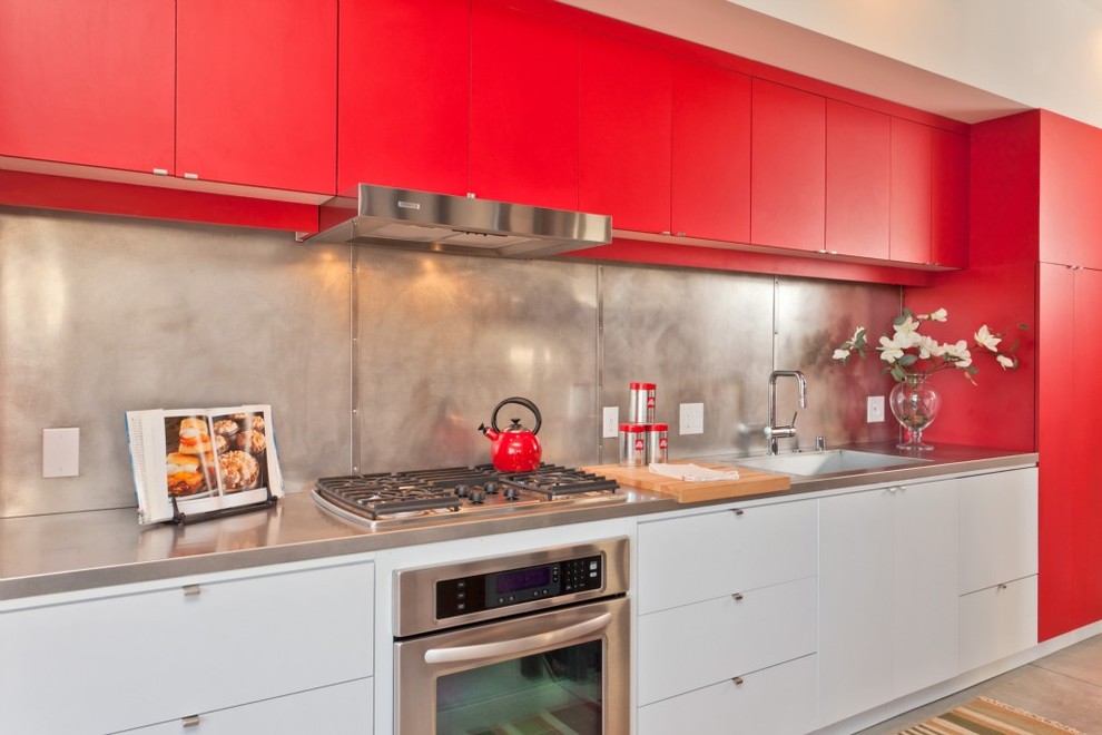 This is an example of a modern kitchen in Seattle with red cabinets.