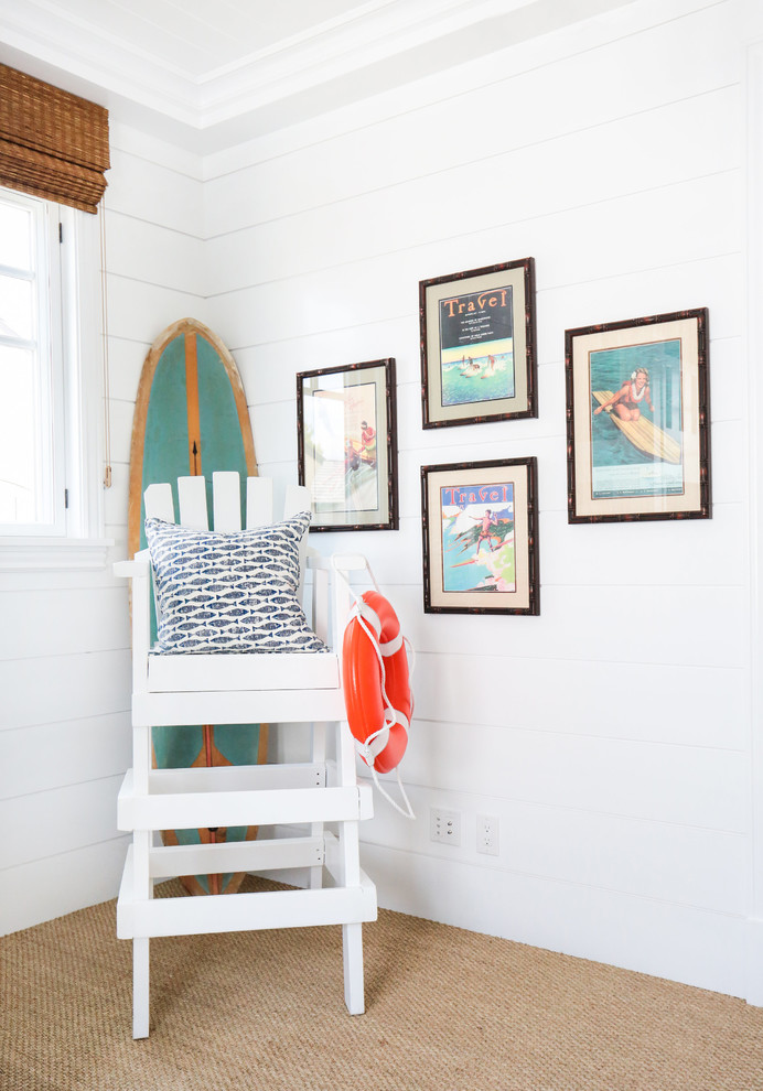 This is an example of a mid-sized beach style gender-neutral kids' bedroom in Orange County with white walls and carpet.