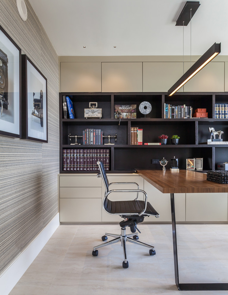 Photo of a large contemporary home office in Miami.