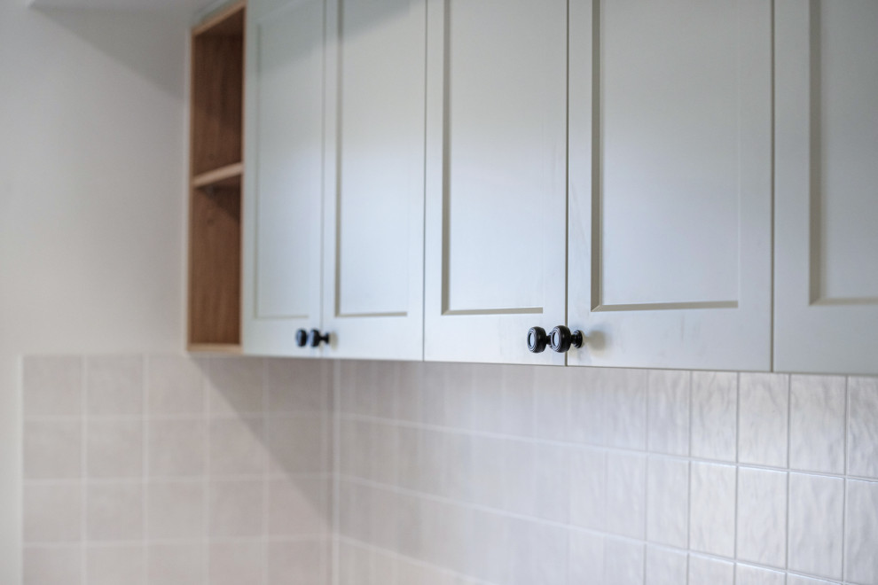 Photo of a traditional laundry room in Other.