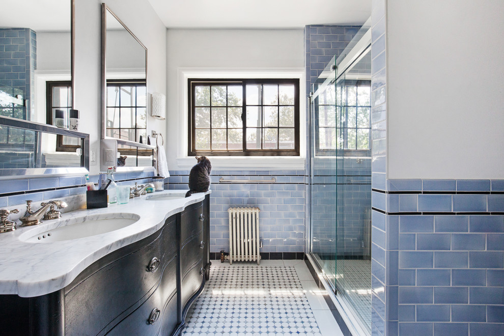 Traditional bathroom in New York with an alcove shower, white walls, a console sink and a sliding shower screen.