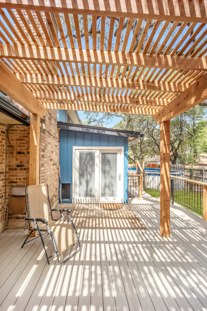 Composite deck, cedar pergola, metal railing with cedar posts