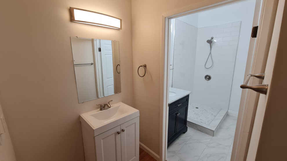 Design ideas for a mid-sized master bathroom in Los Angeles with black cabinets, an open shower, a one-piece toilet, white tile, ceramic tile, white walls, cement tiles, a drop-in sink, quartzite benchtops, yellow floor, a hinged shower door, white benchtops, a single vanity and a freestanding vanity.