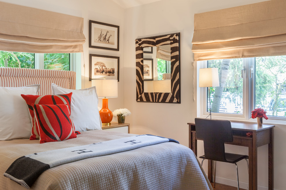 Mid-sized transitional guest bedroom in Miami with beige walls, medium hardwood floors and no fireplace.