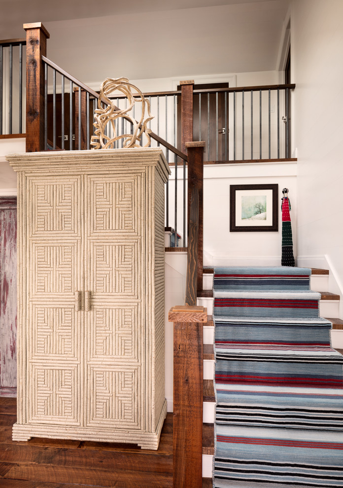 Design ideas for a mid-sized beach style carpeted l-shaped staircase in Milwaukee with carpet risers.