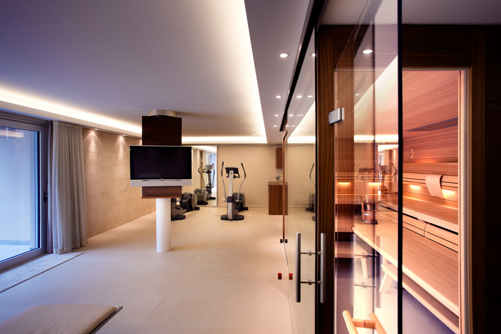 This is an example of a large contemporary home weight room in Other with beige walls, porcelain floors and beige floor.