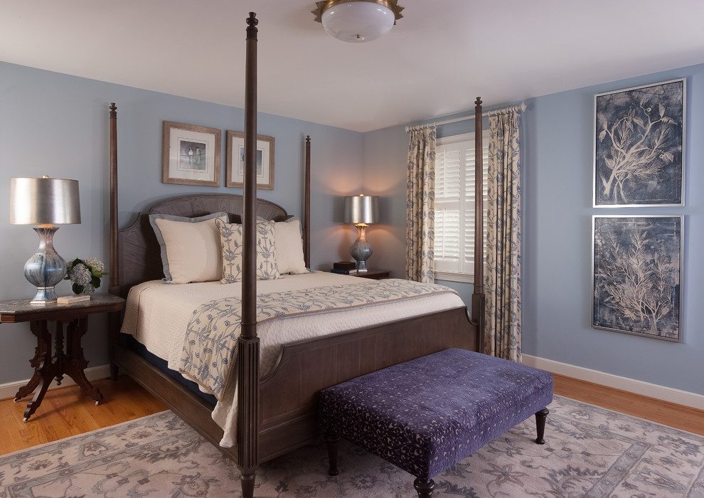 Bedroom - mid-sized transitional master light wood floor and brown floor bedroom idea with blue walls