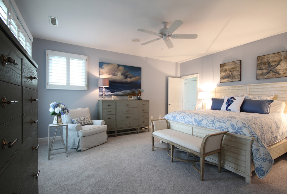 Design ideas for a large beach style master bedroom in Charleston with blue walls, carpet and no fireplace.